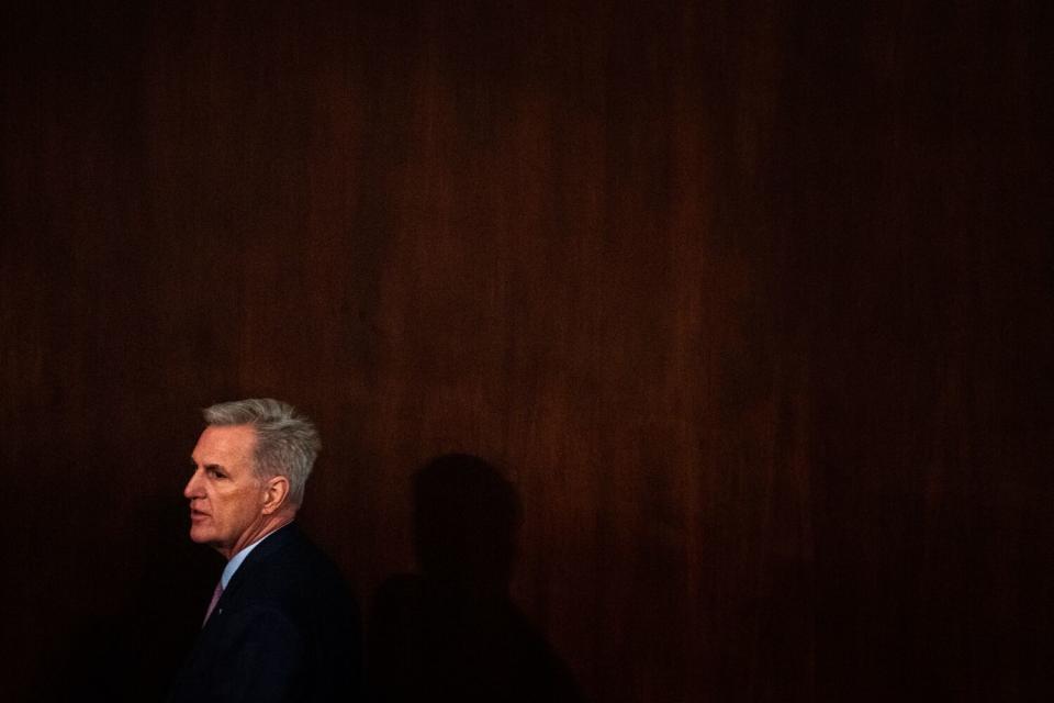 Rep. Kevin McCarthy walks around the floor of the House Chamber.