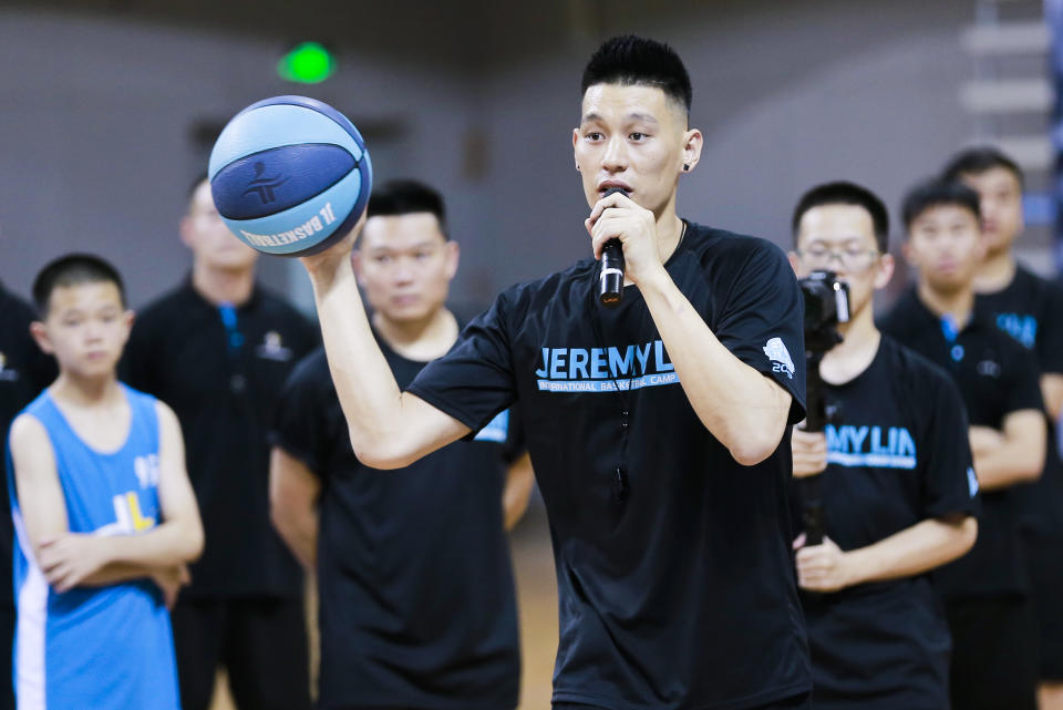 GUANGZHOU, CHINA - AUGUST 07: NBA player Jeremy Lin of the Toronto Raptors plays basketball with children during a basketball camp at Nansha gymnasium on August 7, 2019 in Guangzhou, Guangdong Province of China. (Photo by VCG/VCG via Getty Images)