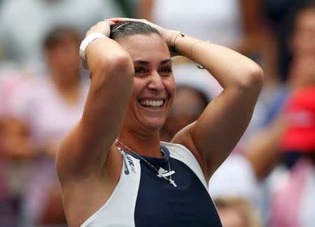 Flavia Pennetta of Italy celebrates after defeating Simona Halep of Romania in their women's singles semi-final match at the U.S. Open Championships tennis tournament in New York, September 11, 2015. REUTERS/Shannon Stapleton Picture Supplied by Action Images