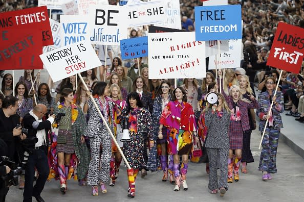 Cara Delevingne walks in Chanel's 2014 fashion show turned feminist rally.