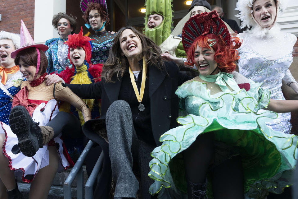 Jennifer Garner, center, performs a kick dance with members of Harvard University's Hasty Pudding Theatricals following a parade which honored her as "Woman of the Year", Saturday, Feb. 5, 2022, in Cambridge, Mass. (AP Photo/Michael Dwyer)