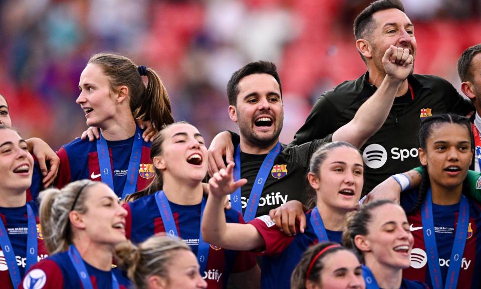 <span>Jonatan Giráldez celebrates with his Barcelona team after his final game in charge.</span><span>Photograph: Ramsey Cardy/Sportsfile/UEFA/Getty Images</span>