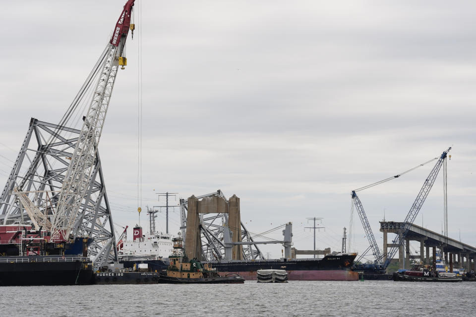 A bulk carrier moves through a newly opened deep-water channel in Baltimore after being stuck in the harbor since the Francis Scott Key Bridge collapsed four weeks ago, Thursday, April 25, 2024. (AP Photo/Matt Rourke)