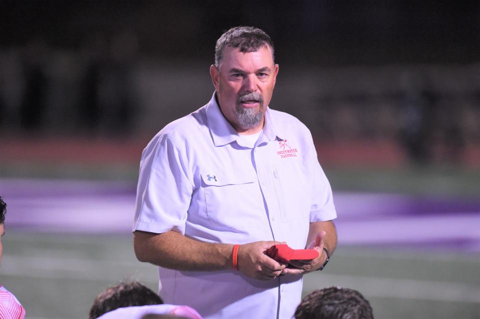 Sweetwater coach Russell Lucas talks to his team following a game in the 2021 season, his first year with the program.