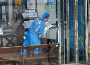 <p>Police officers investigate at a facility for the disabled, where a deadly attack by a knife-wielding man took place, in Sagamihara, Kanagawa prefecture, Japan, July 26, 2016. (REUTERS/Issei Kato)</p>