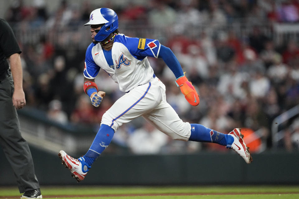 Atlanta Braves' Ronald Acuna Jr. steals second base in the third inning of a baseball game against the Washington Nationals, Saturday, Sept. 30, 2023, in Atlanta. (AP Photo/John Bazemore)