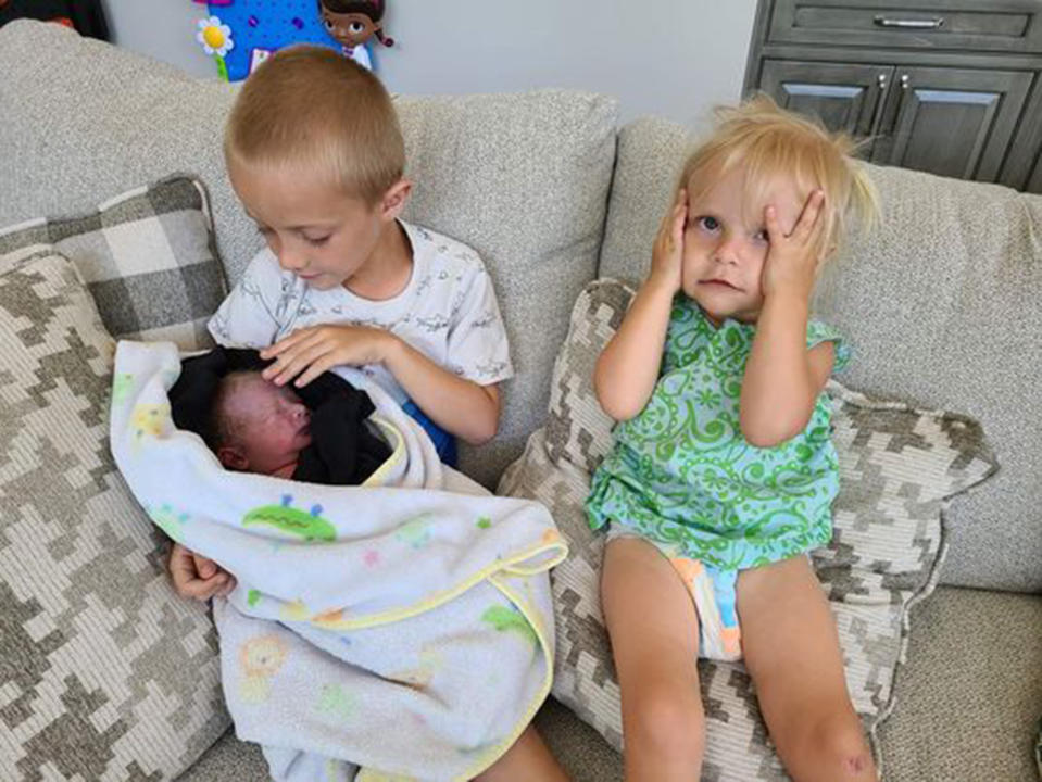 Everyone in the Skaats family is thrilled about their new little brother; although the youngest (on the right) is a little displeased at losing her spot as the baby of the family. (Heather Skaats)