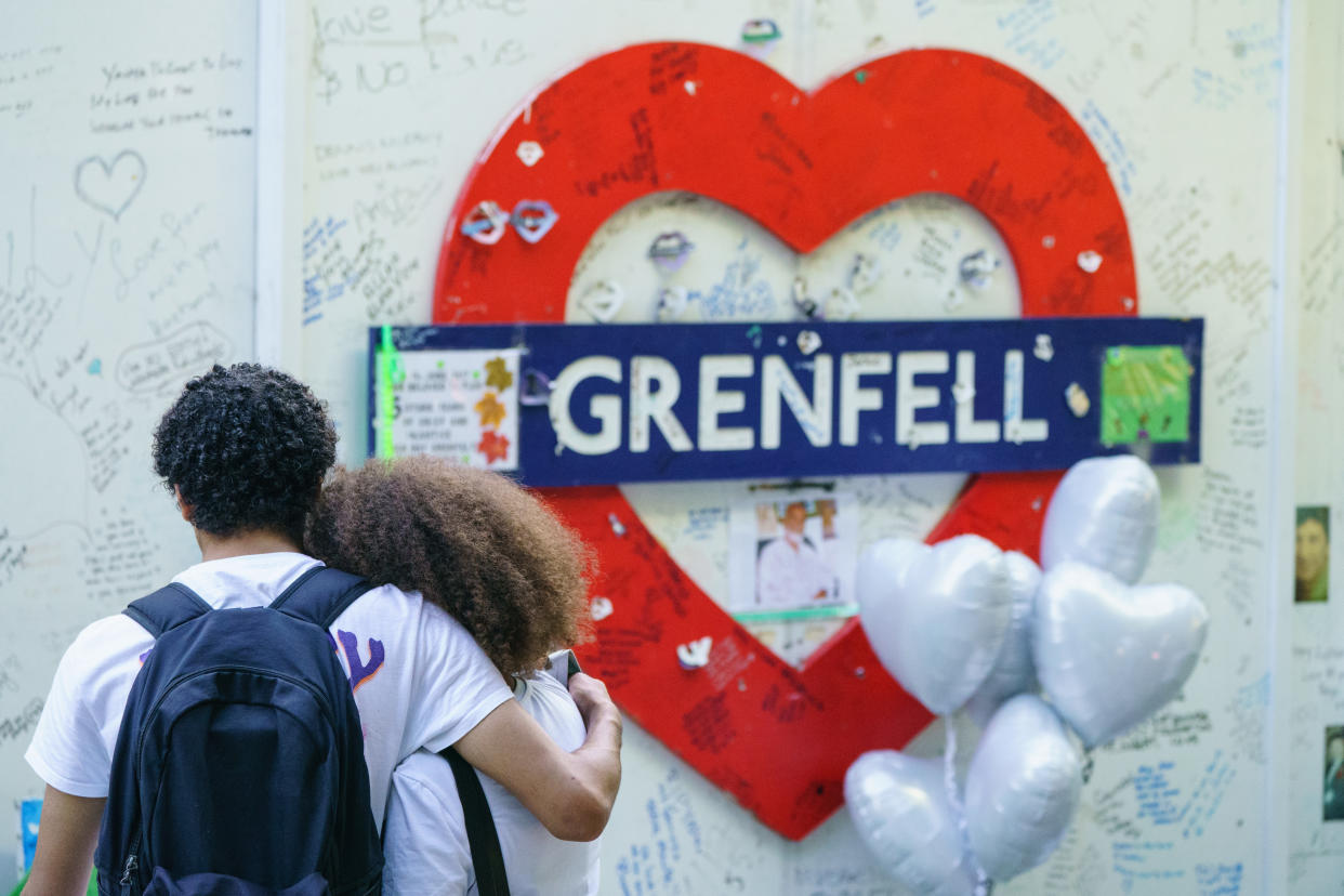 People listen to a multi-faith and wreath laying ceremony at the base of Grenfell Tower in London, in remembrance of those who died in the Grenfell Tower fire on June 14 2018. Picture date: Tuesday June 14, 2022. (Photo by Dominic Lipinski/PA Images via Getty Images)