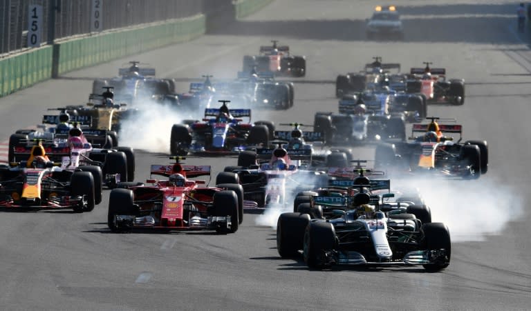 Mercedes' British driver Lewis Hamilton leads the group at the start of the Formula One Azerbaijan Grand Prix at the Baku City Circuit in Baku on June 25, 2017