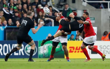 Rugby Union - New Zealand v Tonga - IRB Rugby World Cup 2015 Pool C - St James' Park, Newcastle, England - 9/10/15 New Zealand's Dan Carter in action with Tonga's Paul Ngauamo Action Images via Reuters / Lee Smith