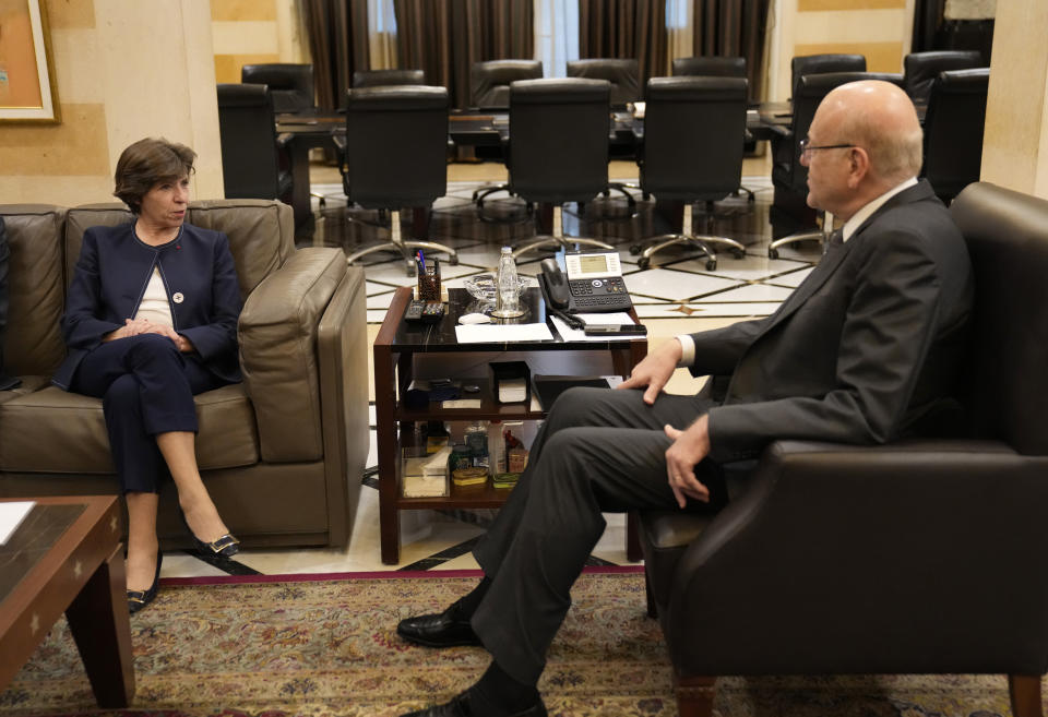 French Foreign Minister Catherine Colonna, left, meets with Lebanese caretaker Prime Minister Najib Mikati, right, at the government palace in Beirut, Lebanon, Monday, Dec. 18, 2023. (AP Photo/Hussein Malla)