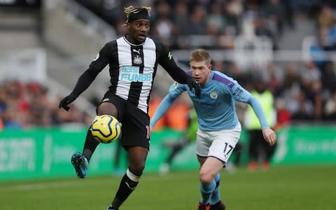 Newcastle United's Allan Saint-Maximin in action with Manchester City's Kevin De Bruyne - Credit: REUTERS