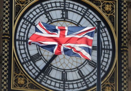 The Union Flag flutters in front of the Big Ben clock tower on the Houses of Parliament in London in this April 12, 2015 file photo. REUTERS/Neil Hall