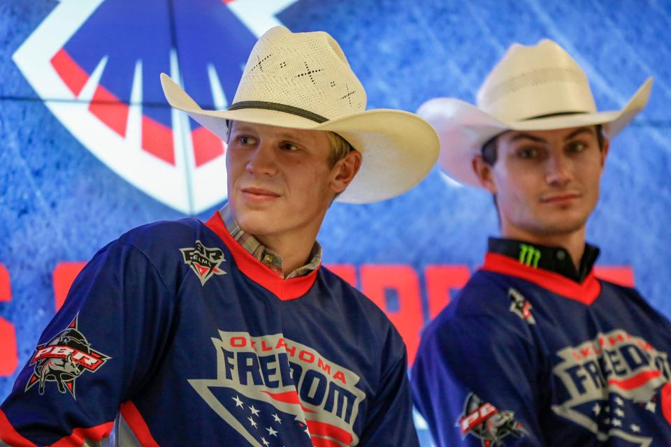 Briggs Madsen, left, of the Oklahoma Freedom bull-riding team sits at a press conference at Paycom Center in Oklahoma City on Wednesday.