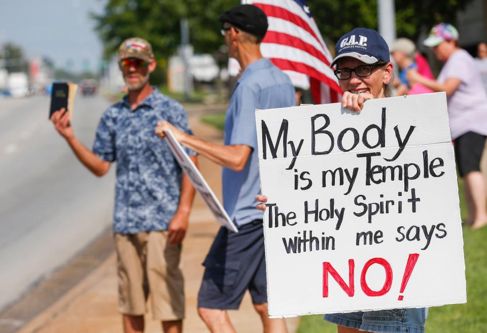 Protesters object to a requirement that employees at Mercy Hospital in Springfield, Missouri, get vaccinated against COVID-19.