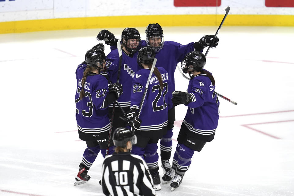 FILE - Minnesota forward Grace Zumwinkle, center left, celebrates with teammates after scoring her second goal during the third period of a PWHL hockey game against Montreal, Saturday, Jan. 6, 2024, in St. Paul, Minn. Zumwinkle is off to a fast start, entering Wednesday, Jan. 10, 2024, leading the league with four goals, two of them game-winners, and registering the PWHL’s first hat-trick. (AP Photo/Abbie Parr, File)