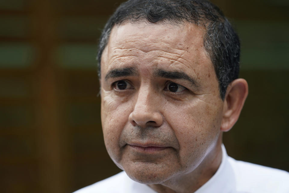 FILE - U.S. Rep. Henry Cuellar, D-Laredo, talks to a member of the media during a campaign event, on Wednesday, May 4, 2022, in San Antonio. Cuellar, a 17-year incumbent is facing a May 24, 2022, Democratic primary runoff against progressive Jessica Cisneros. (AP Photo/Eric Gay File)