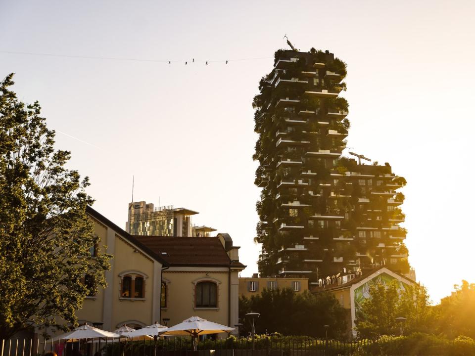 An exterior photo of the Vertical forest building in Milan, Italy.