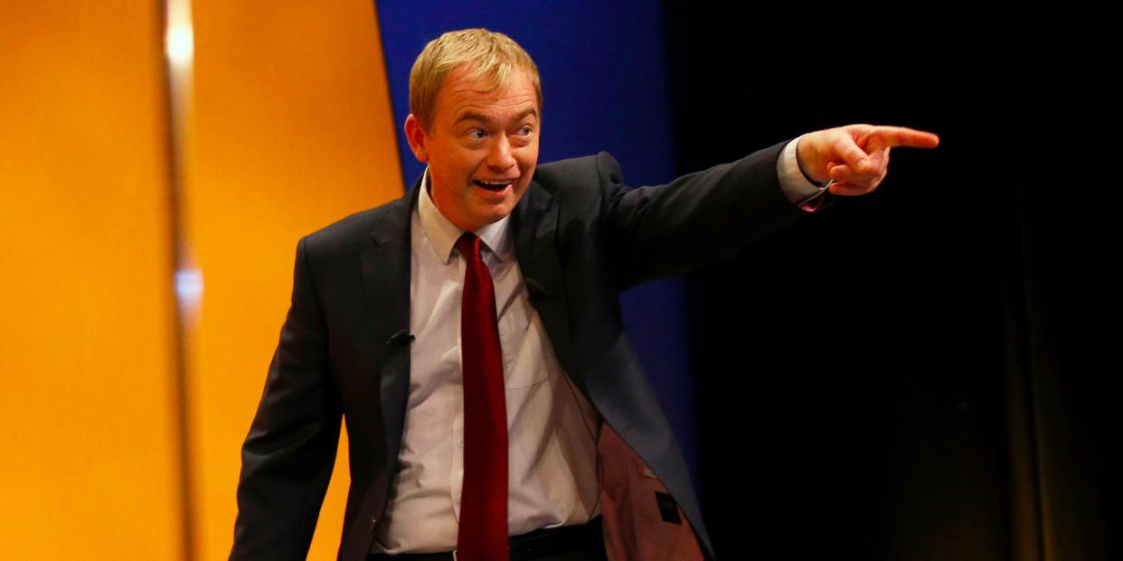 Britain's Liberal Democrat party leader, Tim Farron, gestures as he walks on stage to deliver his keynote speech on the final day of the party's conference in Bournemouth, Britain September 23, 2015. REUTERS/Peter Nicholls