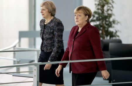 German Chancellor Angela Merkel and Britain's Prime Minister Theresa May arrive for a statement prior to a meeting at the chancellery in Berlin, Germany, November 18, 2016. REUTERS/Michael Sohn/Pool