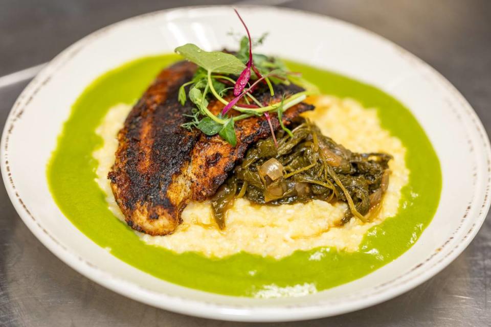 Catfish & Grits at Community Matters Cafe comes with blackened catfish, grits, braised mustard greens and parsley gravy. Alex Cason/CharlotteFive