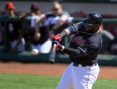 FILE PHOTO: Mar 18, 2019; Goodyear, AZ, USA; Cleveland Indians first baseman Carlos Santana (41) bats against the San Diego Padres during the fourth inning at Goodyear Ballpark. Mandatory Credit: Joe Camporeale-USA TODAY Sports