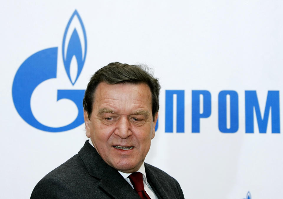 File--- File photo shows Former German Chancellor Gerhard Schroeder walking in Russian natural gas monopoly Gazprom headquarters in Moscow, Thursday, March 30, 2006. German Chancellor Olaf Scholz is flying to Washington this week on a mission to reassure Americans that his country stands alongside the United States and other NATO partners in opposing any Russian aggression against Ukraine.(AP Photo/ Alexander Zemlianichenko, file )