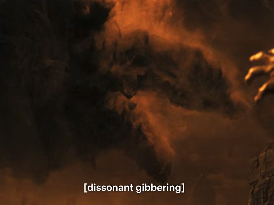 a screenshot from stranger things with the descriptive subtitle text "[dissonant gibbering]" at the bottom. the image shows a sepia-toned hand reaching out towards a mass of swirling dust particles, coalescing somewhat into a creature with long legs