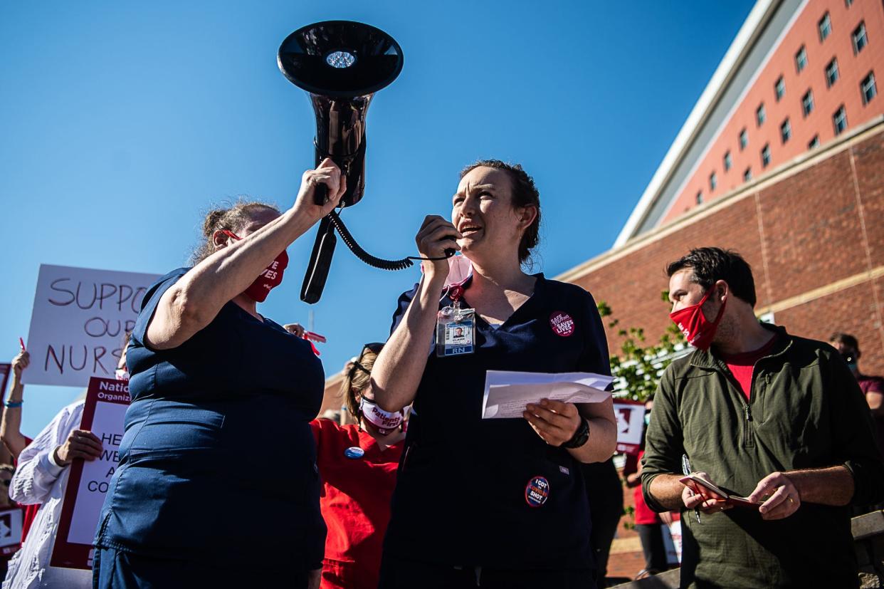 Claire Siegel, an RN in the medical surgical unit at Mission and on the union negotiating team, speaks to fellow nurses and community members who gathered to picket in front of Mission Hospital on Tuesday, June 15, 2021. Union nurses are claiming victory after Mission Health announced a decision to raise wages by $22 million Sept. 7.