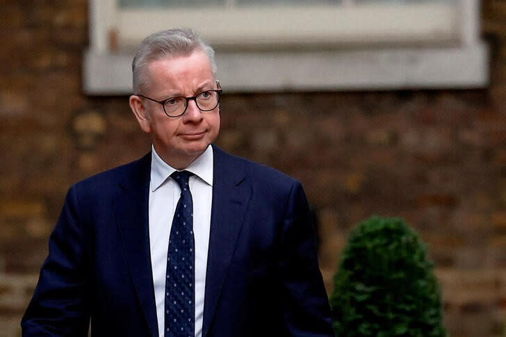 FILE PHOTO: Michael Gove walks outside Number 10 Downing Street in London