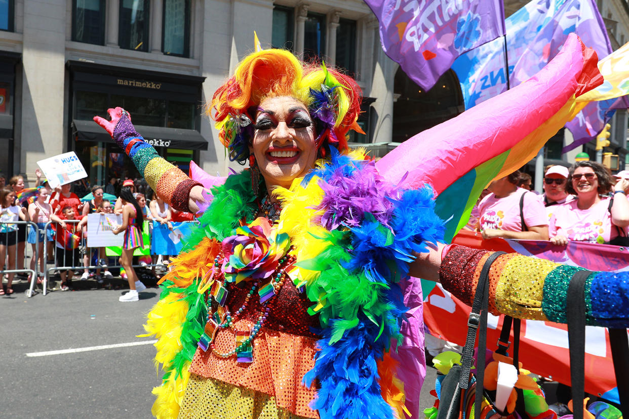 A marcher dressed as a rainbow gestures for the camera during the N.Y.C. Pride Parade in New York on June 30, 2019. (Photo: Gordon Donovan/Yahoo News)