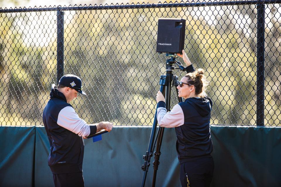 Dr. Georgia Giblin sets up a Trackman device at a spring training workout at Joker Marchant Stadium in Lakeland, Florida on February 20, 2022.