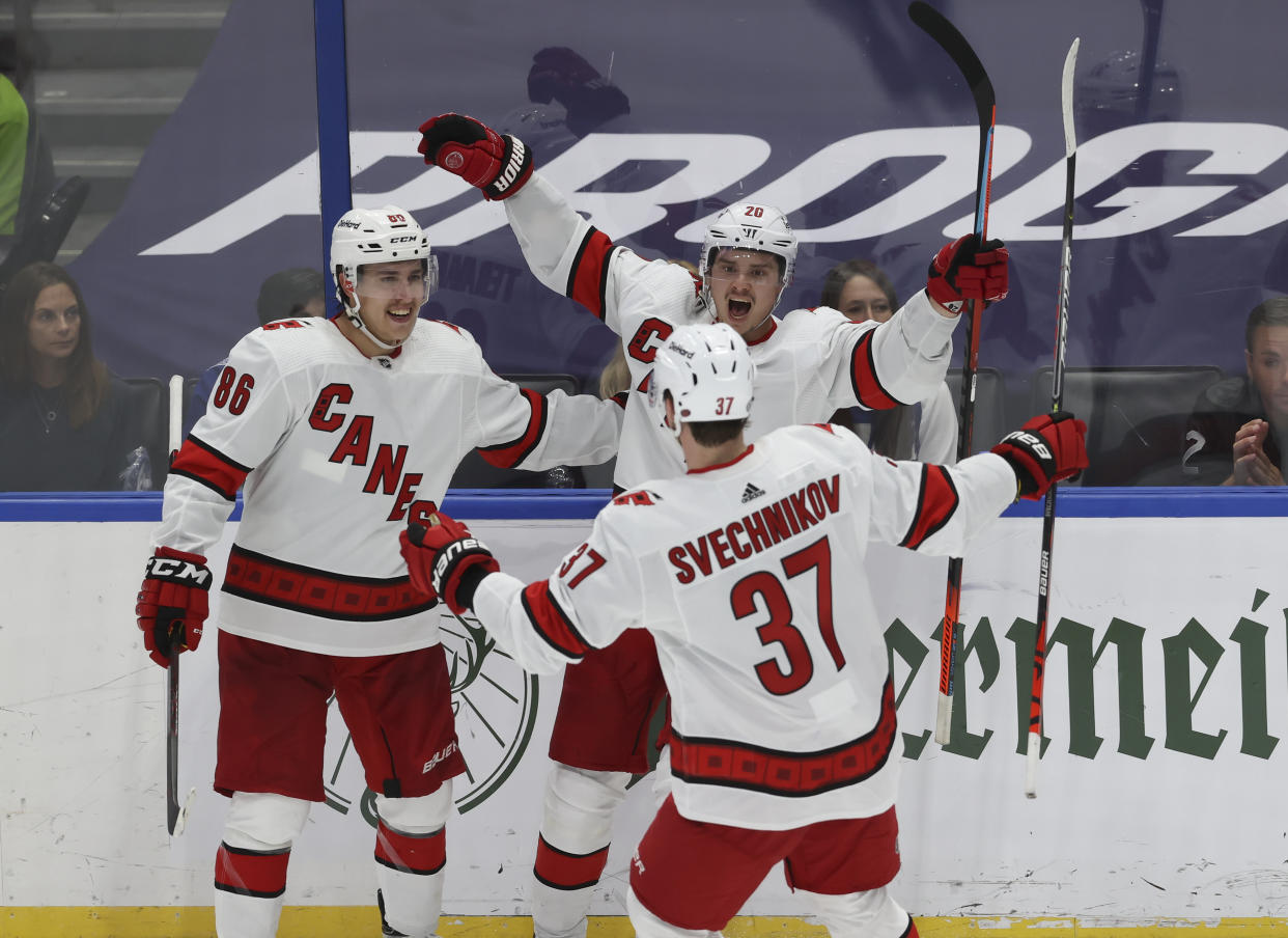 TAMPA, FL - JUNE 03: Carolina Hurricanes right wing Sebastian Aho (20) celebrates with Andrei Svechnikov (37) and Martin Necas (88) after scoring a goal in the second period of Game 3 of the Second Round of the Stanley Cup Playoffs between the Carolina Hurricanes and Tampa Bay Lightning on June 03, 2021 at Amalie Arena in Tampa, FL. (Photo by Mark LoMoglio/Icon Sportswire via Getty Images)