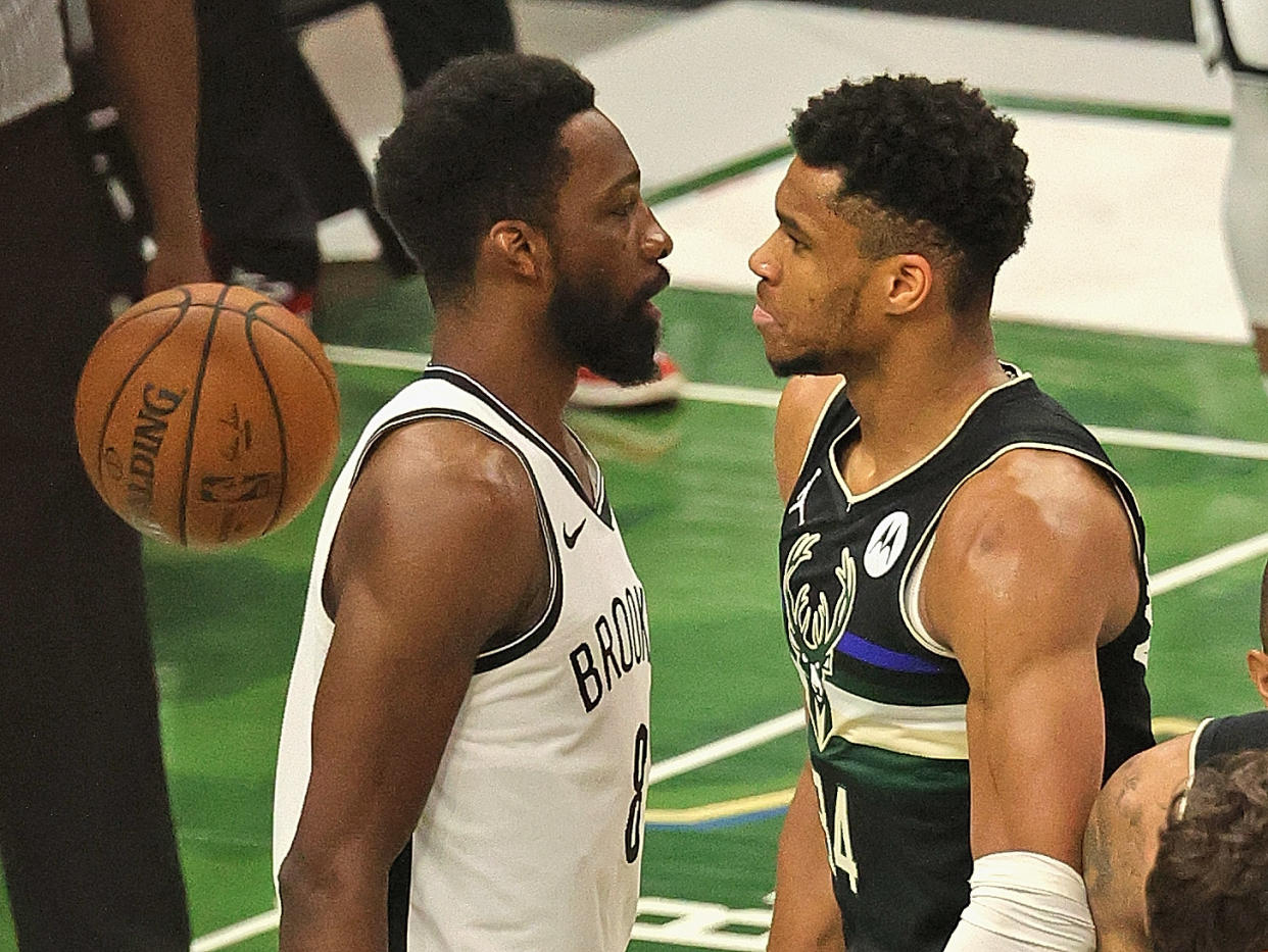 MILWAUKEE, WISCONSIN - JUNE 17: Giannis Antetokounmpo #34 of the Milwaukee Bucks stares down Jeff Green #8 of the Brooklyn Nets after dunking on him at Fiserv Forum on June 17, 2021 in Milwaukee, Wisconsin. The Bucks defeated the Nets 104-89. NOTE TO USER: User expressly acknowledges and agrees that, by downloading and or using this photograph, User is consenting to the terms and conditions of the Getty Images License Agreement.  (Photo by Jonathan Daniel/Getty Images)