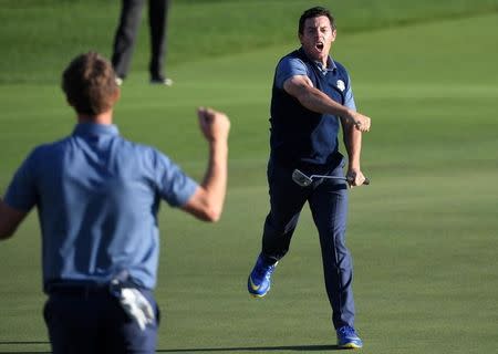 Sep 30, 2016; Chaska, MN, USA; Rory McIlroy of Northern Ireland celebrates winning his match on the 16th green in the afternoon four-ball matches during the 41st Ryder Cup at Hazeltine National Golf Club. Michael Madrid-USA TODAY Sports