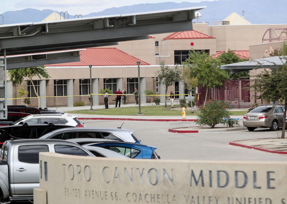 Riverside County Sheriff's officers and police investigate the area around Toro Canyon Middle School and Desert Mirage High School after an unknown incident forced the school's evacuation in Thermal, Calif., Nov. 2, 2022.