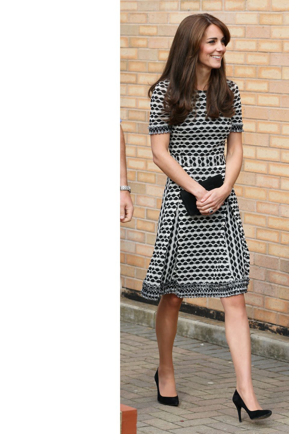 <p>The Duchess makes a public appearance for World Mental Health Day wearing a Tory Burch dress with simple black pumps and a clutch. </p>