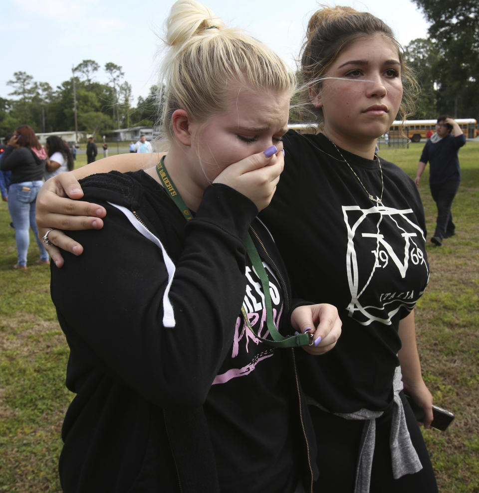 <p>Students are led out of Forest High School after a shooting at the school on Friday, April 20, 2018 in Ocala, Fla. (Photo: Bruce Ackerman/Star-Banner via AP) </p>