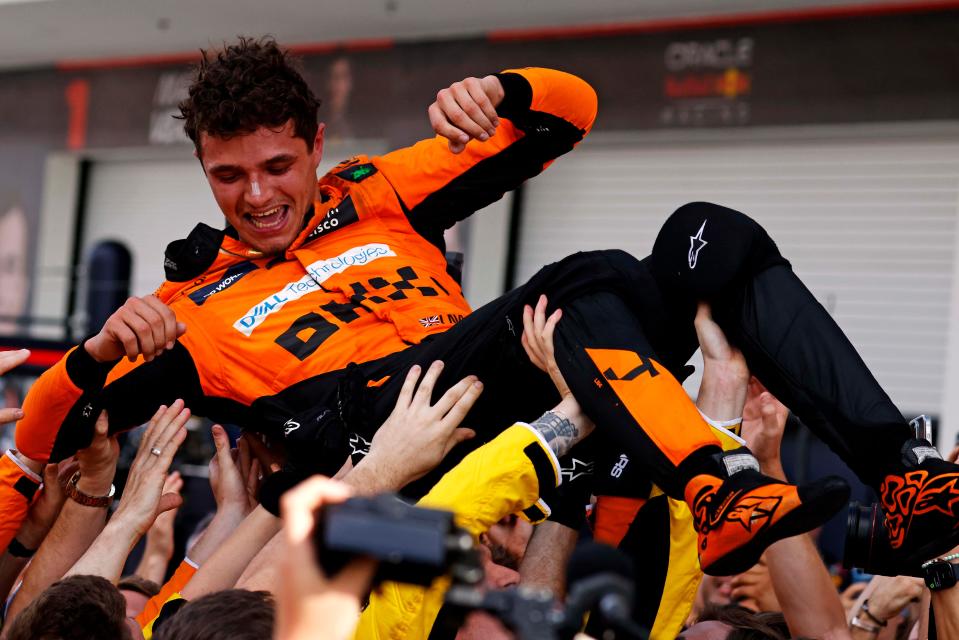 Lando Norris celebrates with his McLaren team after winning the Formula One Miami Grand Prix.