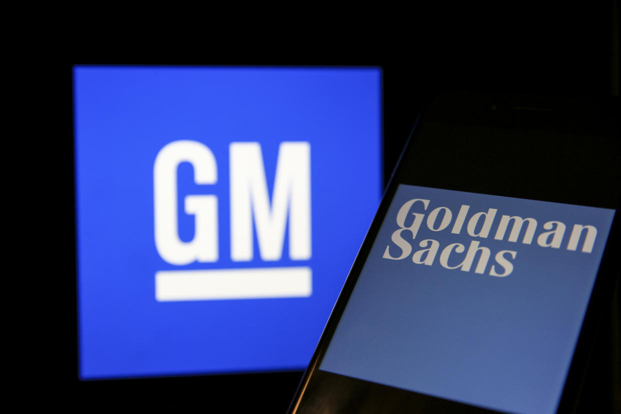 ANKARA, TURKEY - OCTOBER 20: In this photo illustration, a mobile phone screen displays logo of the Goldman Sachs Groups Inc. in front of a computer screen displaying the logo of General Motors Co. in Ankara, Turkey on October 20, 2020. (Photo by Muhammed Selim Korkutata/Anadolu Agency via Getty Images)