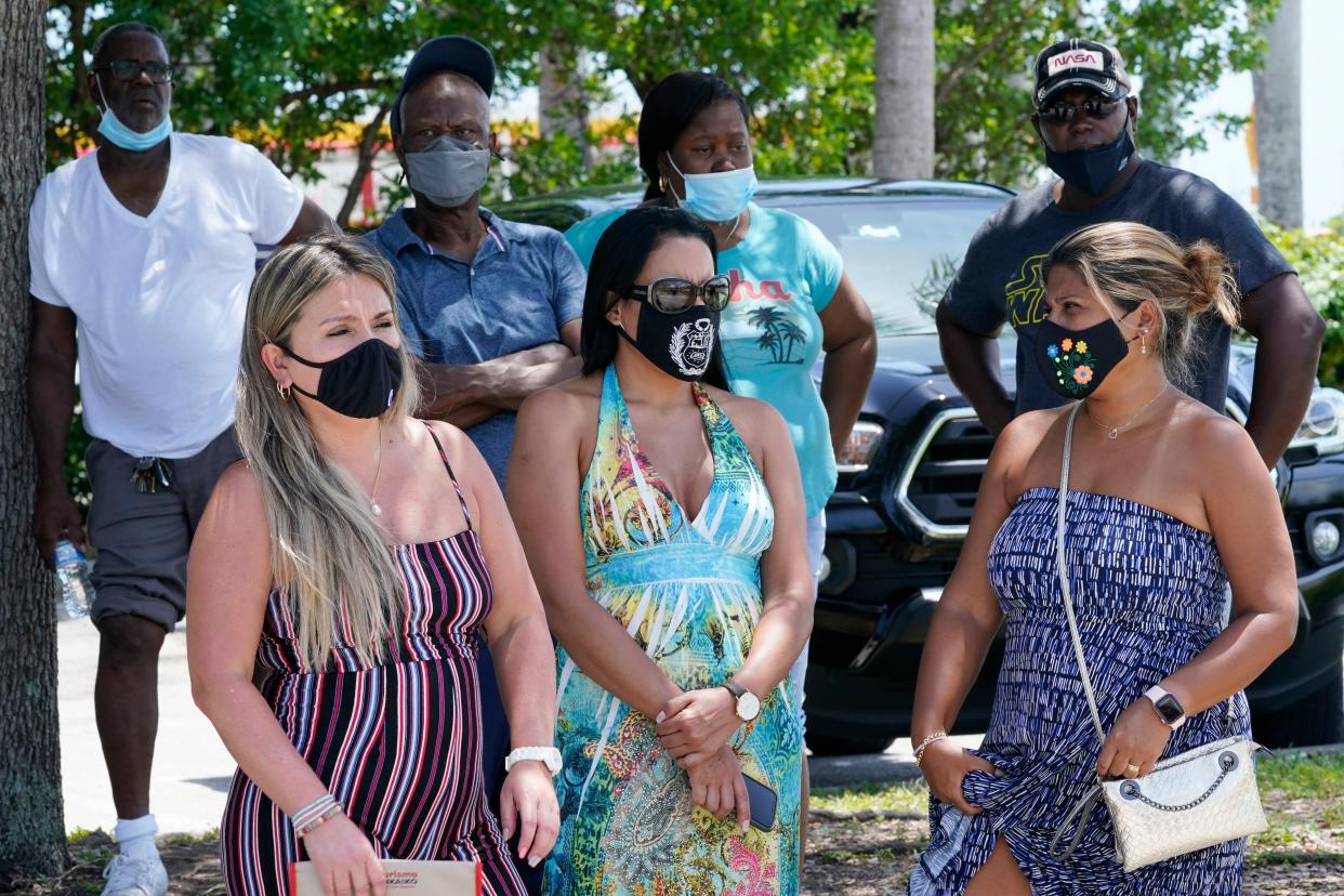 A group waits to get a COVID-19 test, Saturday, July 31, 2021, in North Miami, Fla. Federal health officials say Florida has reported 21,683 new cases of COVID-19, the state's highest one-day total since the start of the pandemic. The state has become the new national epicenter for the virus, accounting for around a fifth of all new cases in the U.S. Florida Gov. Ron DeSantis has resisted mandatory mask mandates and vaccine.