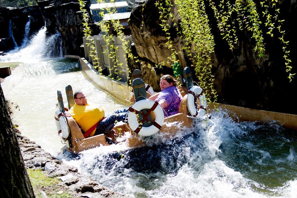 Visitors ride Smoky Mountain River Rampage during opening day at Dollywood in Pigeon Forge, Tennessee on Saturday, March 18, 2017.