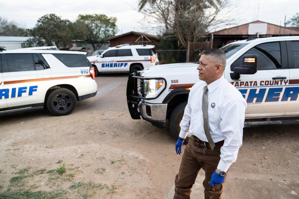 Texas Ranger E.J. Salinas stands outside of the mobile home as Zapata County Sheriff’s Office deputies conduct a search for drugs inside on Wednesday, Feb. 7, 2024.