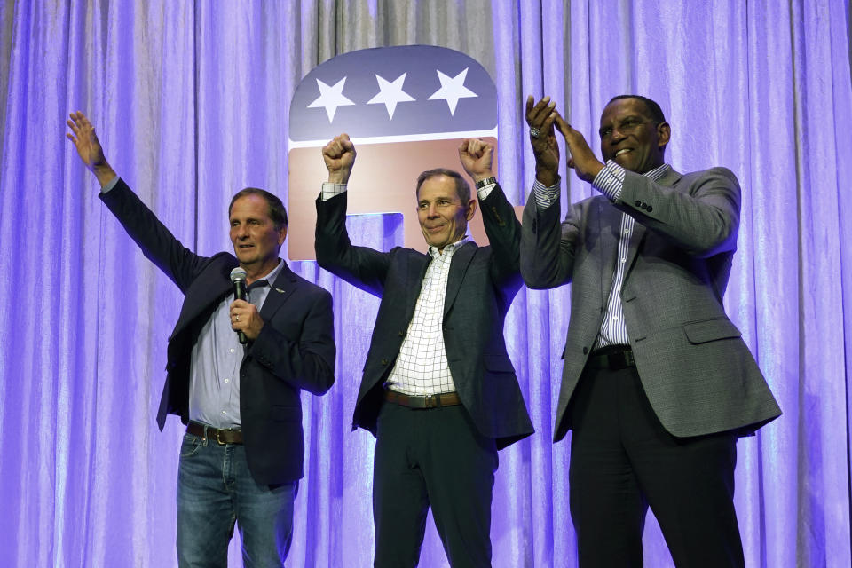 From left to right, Utah Republican Congressmen Chris Stewart, John Curtis, Burgess Owens speak during an election night party Tuesday, Nov. 8, 2022, in Salt Lake City. (AP Photo/Rick Bowmer)