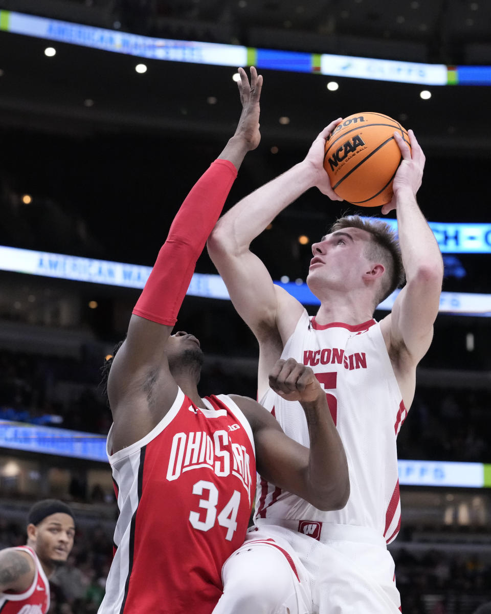 Wisconsin's Tyler Wahl shoots over Ohio State's Felix Okpara during the second half of an NCAA college basketball game at the Big Ten men's tournament, Wednesday, March 8, 2023, in Chicago. Ohio State won 65-57. (AP Photo/Charles Rex Arbogast)