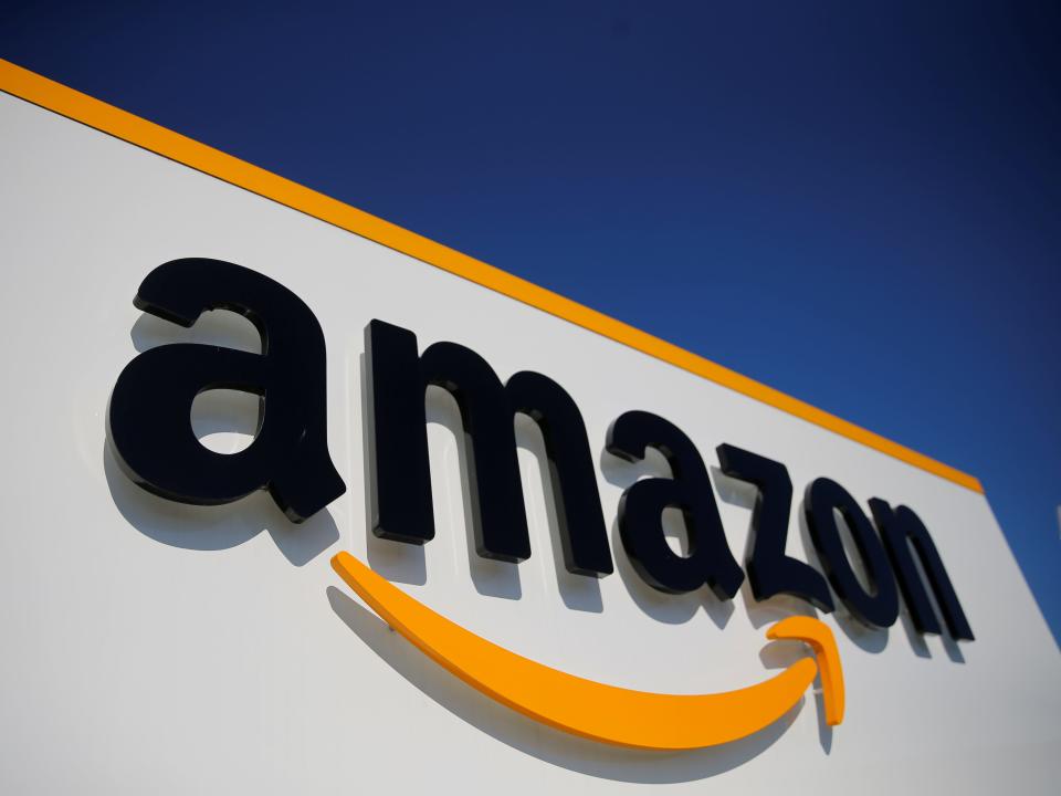 FILE PHOTO: The logo of Amazon is seen at the company logistics center in Lauwin-Planque, northern France, April 22, 2020 after Amazon extended the closure of its French warehouses until April 25 included, following dispute with unions over health protection measures amid the coronavirus disease (COVID-19) outbreak.  REUTERS/Pascal Rossignol