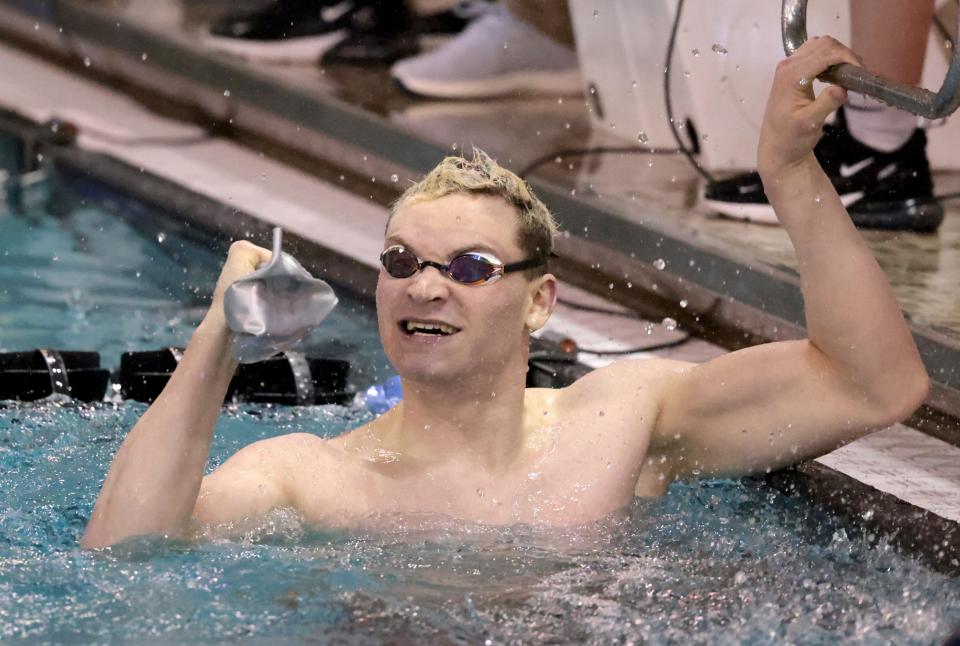 Dover's Lucas Lane celebrates his finish in the 100 yard freestyle in the OHSAA Division II state meet at C.T. Branin Natatorium, Friday, Feb. 24, 2023.