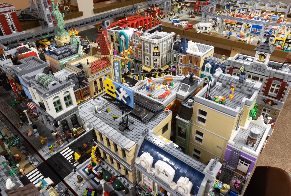 A custom Lego town, the centerpiece of Scott Brown's Lego collection, sits in the basement of Brown's Plain Township home.