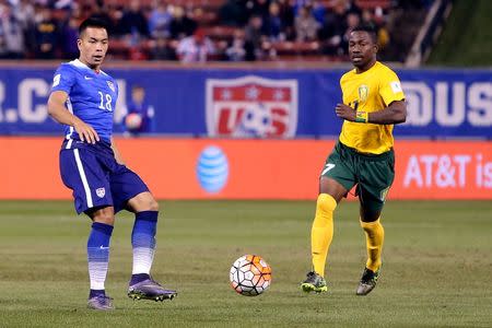 Nov 13, 2015; St.Louis, MO, USA; USA forward Bobby Wood (18) passes the ball while under pressure from St. Vincent & The Grenadines midfielder Seinard Bowens (17) during the second half of a FIFA World Cup Qualifying soccer match at Busch Stadium. USA won 6-1. Scott Kane-USA TODAY Sports