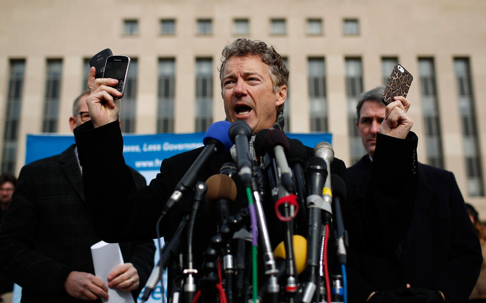 WASHINGTON, DC - FEBRUARY 12:  U.S. Sen. Rand Paul (R-KY) (C) holds up a group of cell phones in front of U.S. District Court to announce the filing of a class action lawsuit against the administration of U.S. President Barack Obama, Director of National Intelligence James Clapper, National Security Agency Director Keith Alexander and FBI Director James Comey. Paul said he filed the lawsuit to stop NSA surveillance of U.S. phone records because Obama has Òpublicly refused to stop a clear and continuing violation of the 4th amendment.  (Photo by Win McNamee/Getty Images)